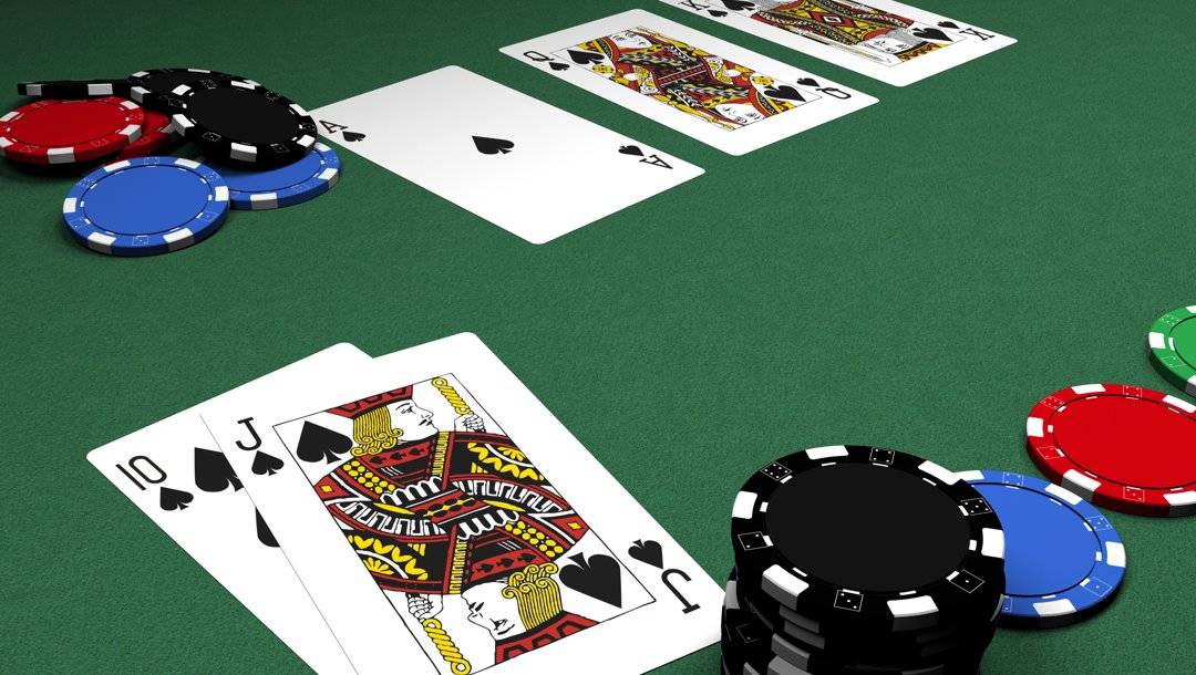 A poker player has revealed their hand. It’s a jack and a 10 of spades. The community cards are an ace, queen, and king of spades, giving them a royal flush.