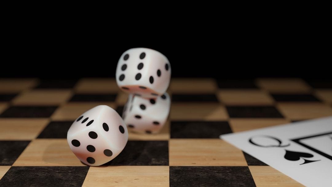 Dice and playing cards on a chessboard.