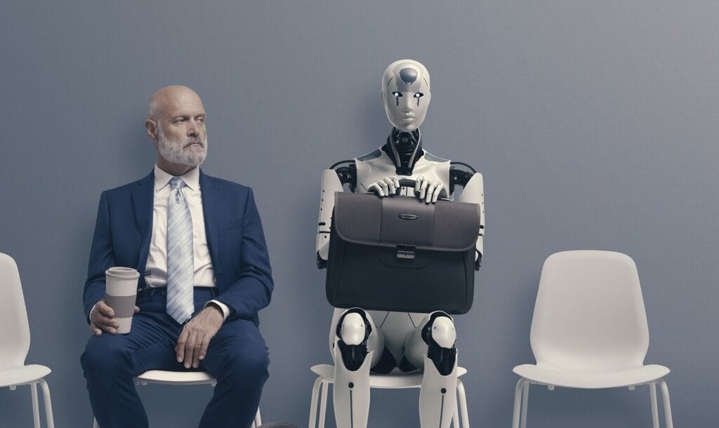 A man sits next to a robot in a waiting room