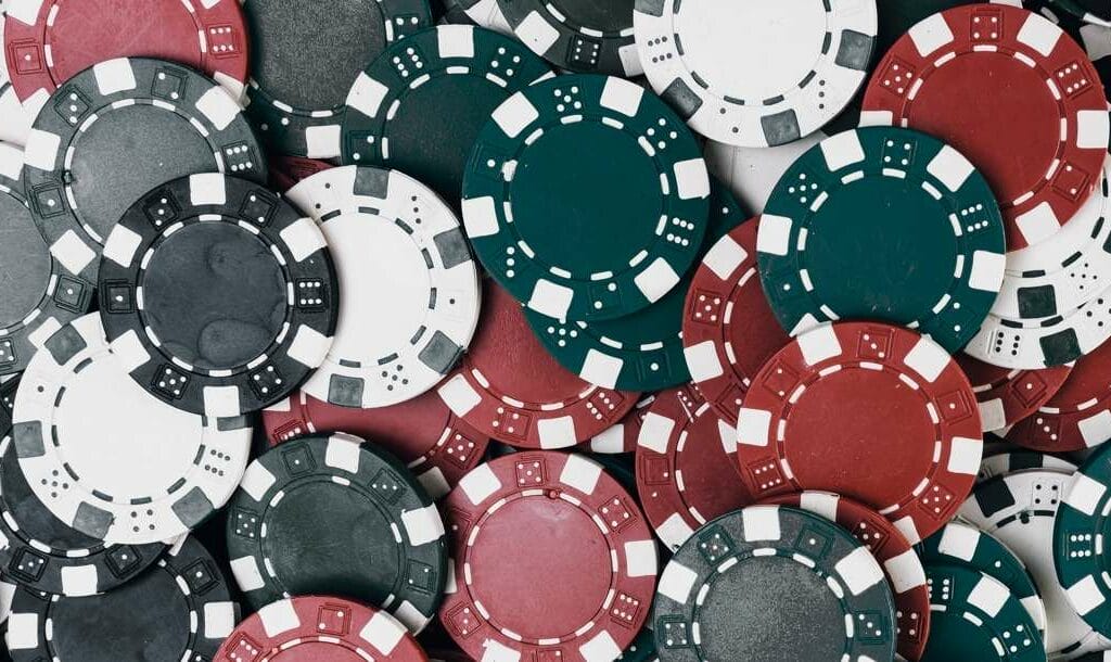 Green, red, black, and white poker chips