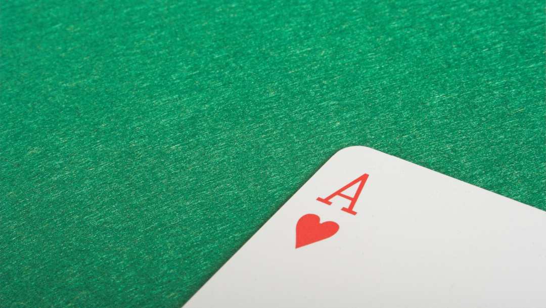An ace of hearts on a poker table