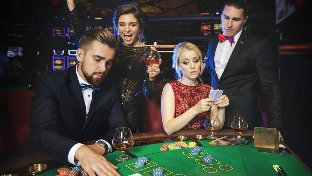 Group of people playing poker at the casino