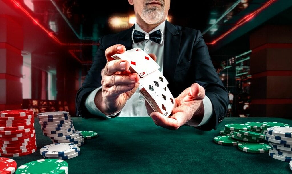 Poker dice on a black wooden table with poker chips