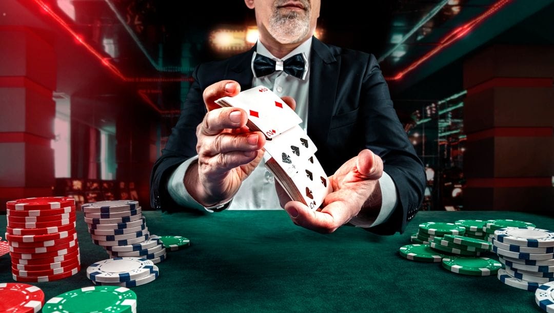 Poker dice on a black wooden table with poker chips