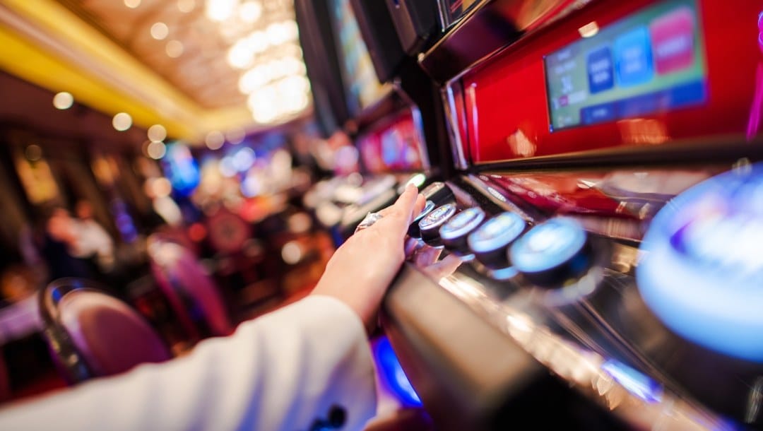 Person playing video slot in the casino