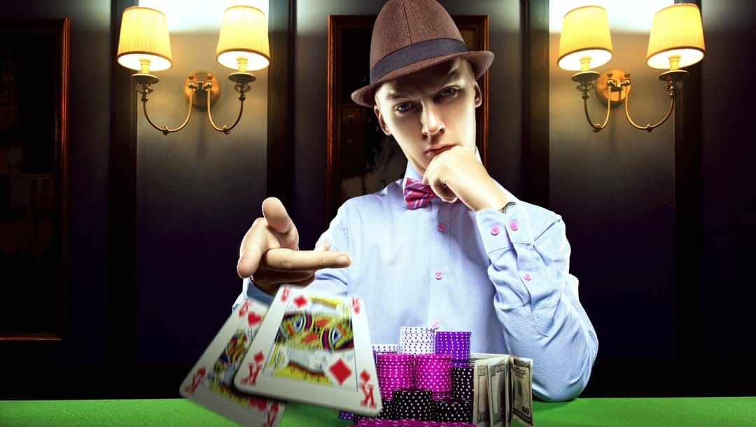A man in a hat plays stud poker