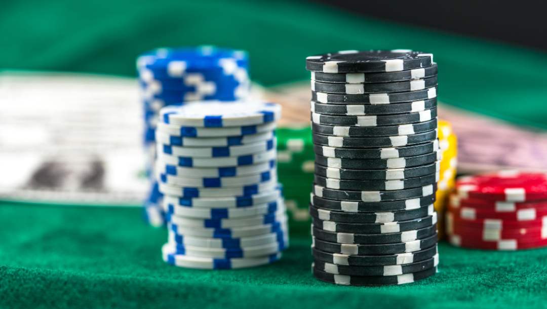 Poker chips and money on a poker table