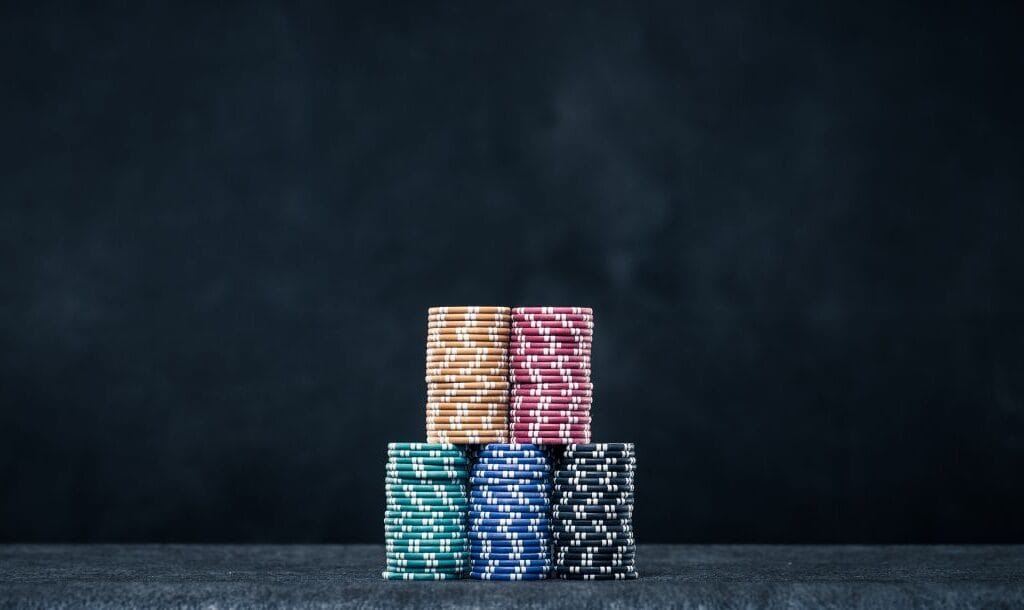 Stacks of poker chips neatly piled on top of each other.