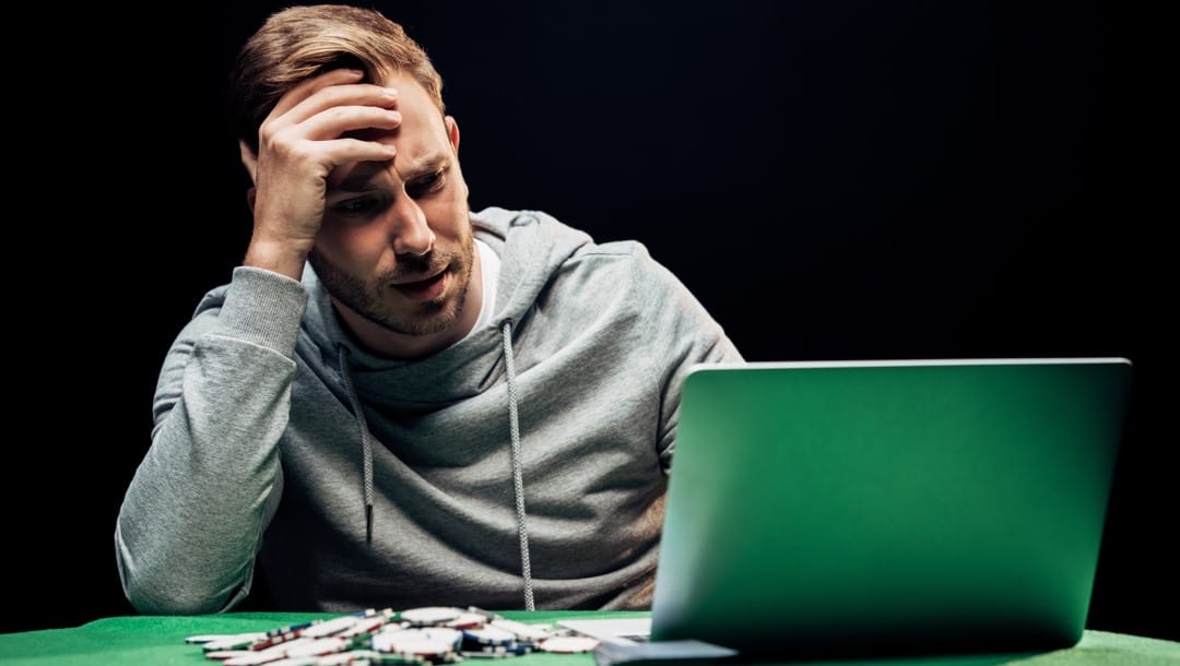 A man concentrates on online poker