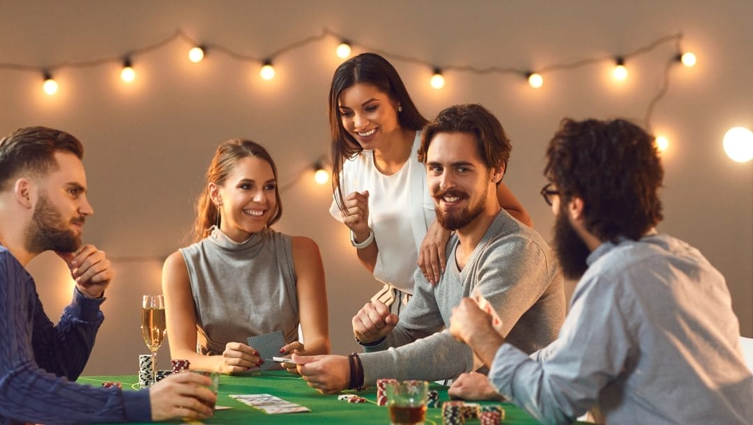 A group of friends play poker at home