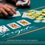 Live blackjack table at Borgata Casino & Spa, showing a player’s hand, stacked chips, and face-up cards during an active round of casino play.