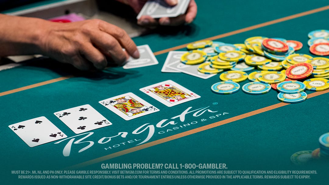 Live blackjack table at Borgata Casino & Spa, showing a player’s hand, stacked chips, and face-up cards during an active round of casino play.