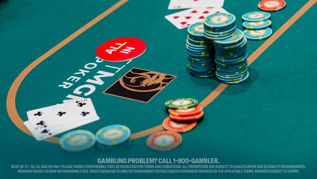 A poker table set with colorful chips and playing cards, ready for a game.