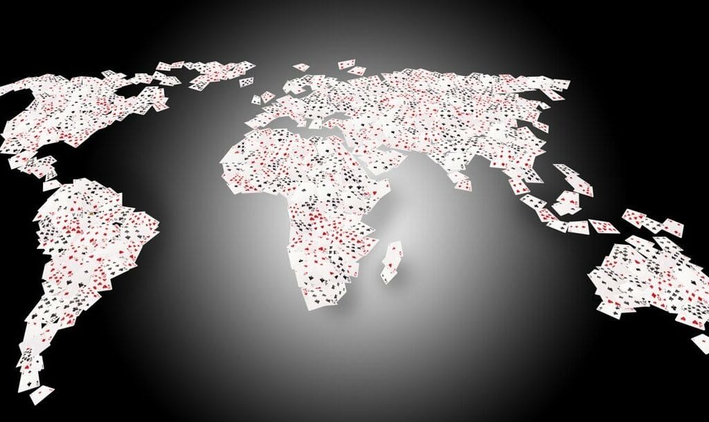 Playing cards making up a map of the world