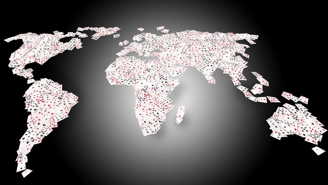 Playing cards making up a map of the world