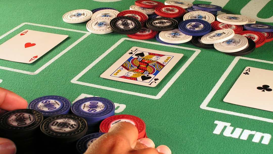 A poker player betting all of his chips in a hand of Texas Hold'em