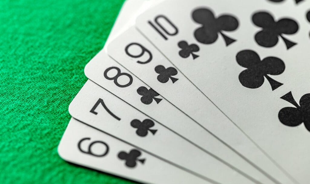 A straight flush on a green casino table.