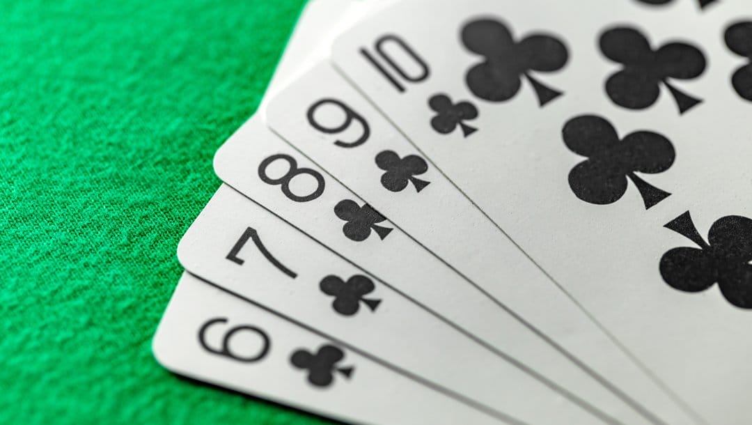 A straight flush on a green casino table.