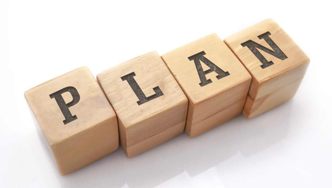 Wooden blocks with the word “Plan” printed on them.