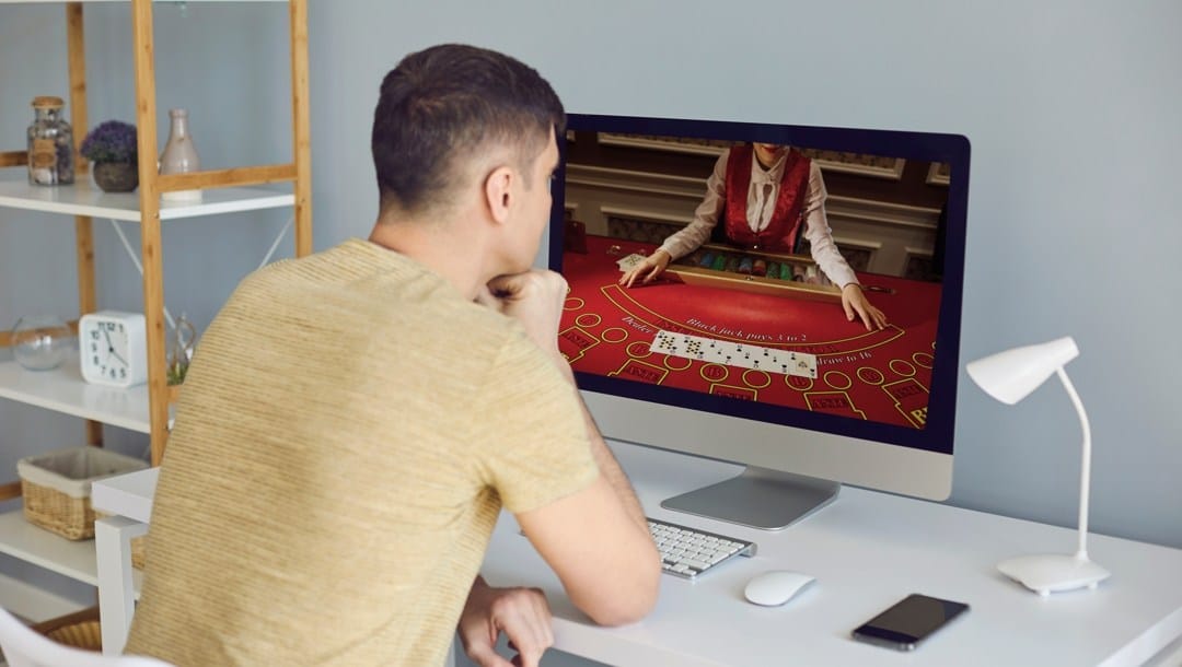 A man plays online casino video poker