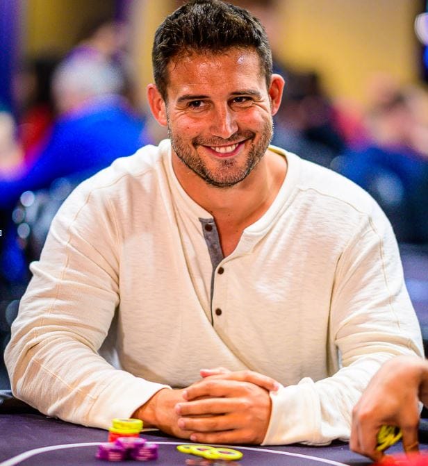 Darren Elias plays at a poker table. Poker player Darren Elias at poker table.
