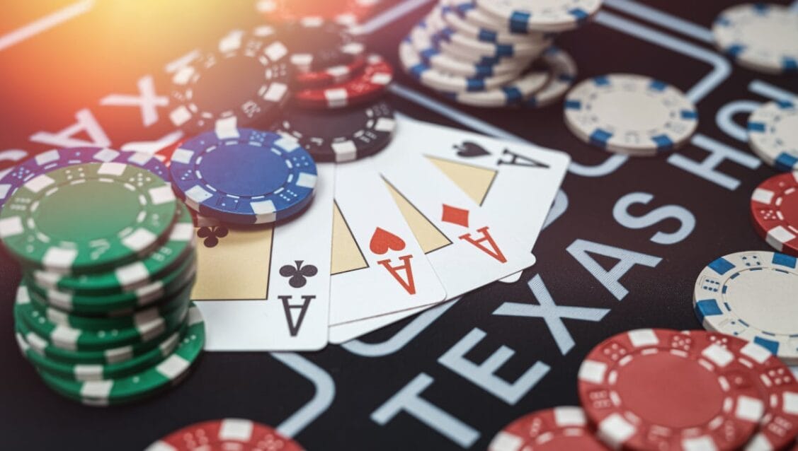 Poker chips and cards on a table labeled "TEXAS" indicate a game of poker.