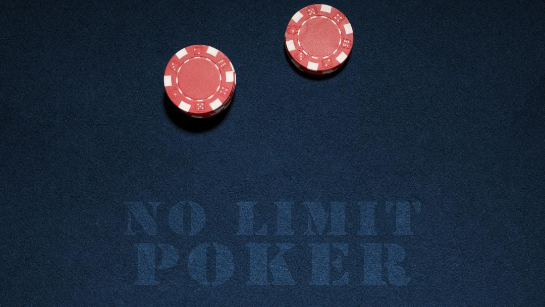 No Limit Poker signage on a navy blue felt table with red casino chips.
