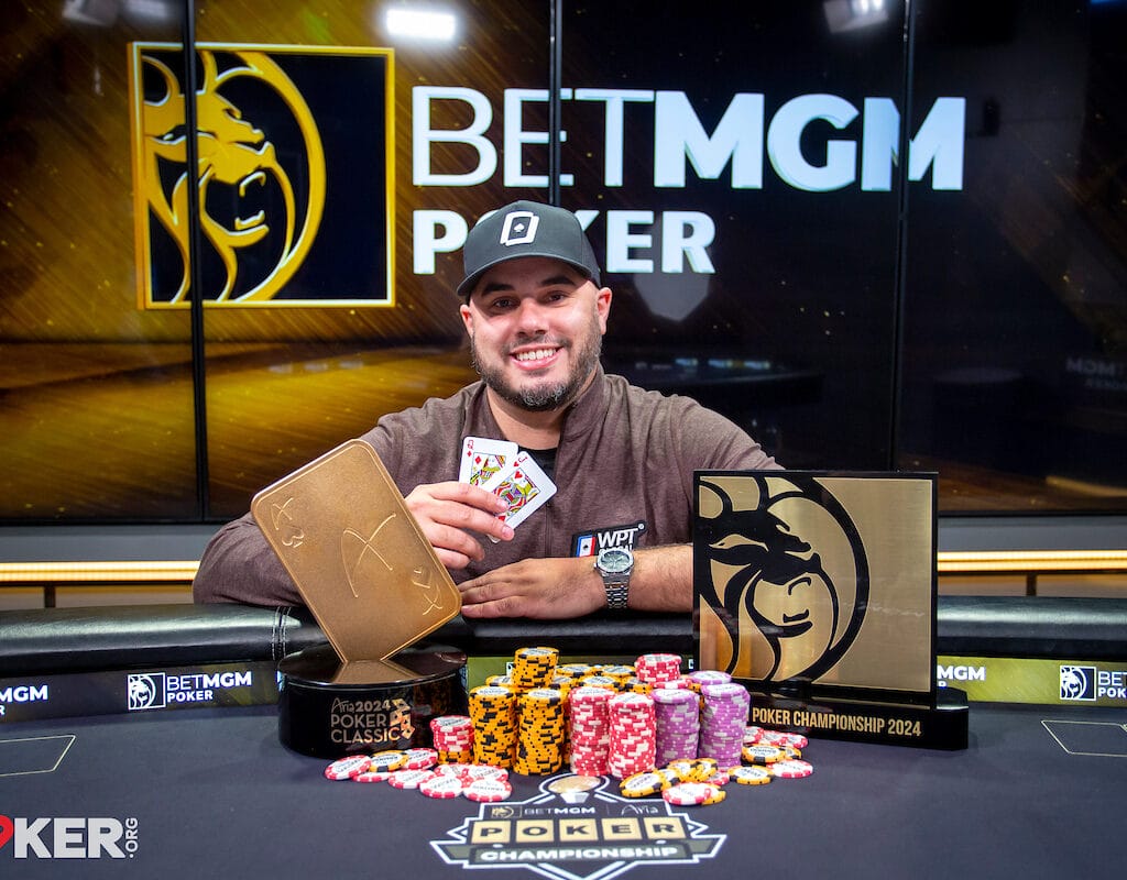 Daniel Maor sitting at a poker table with a stack of poker chips in front of him. Photo credit PokerOrg/8131 Media