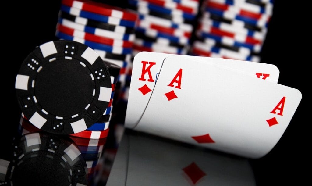 Ace-and-king-hole-cards-on-a-black-table-next-to-poker-chips-Ace-king