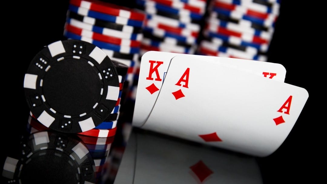 Ace-and-king-hole-cards-on-a-black-table-next-to-poker-chips-Ace-king