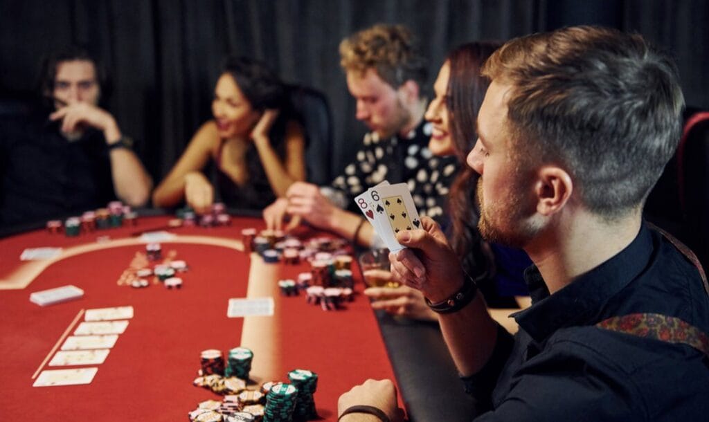 A-poker-player-raises-his-cards-to-look-at-them-What-are-combo-draws