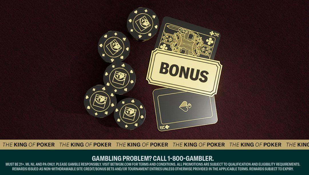 Three face-down playing cards, one of which has the word “Bonus” on it, face down on a dark purple felt table alongside stacks of black poker chips.