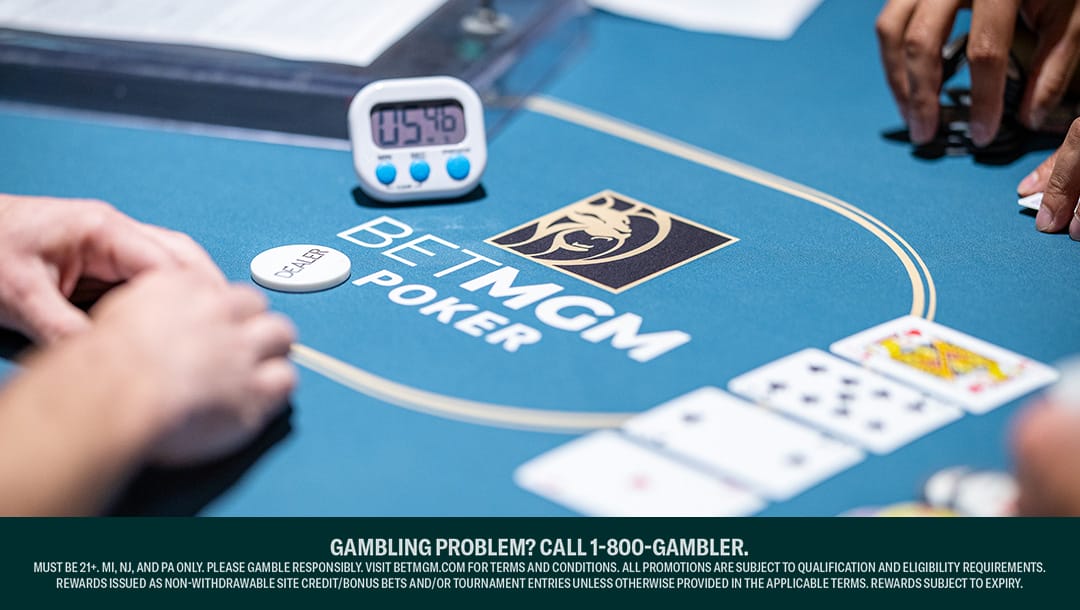 A view of a BetMGM Poker table. It has a timer on it, a dealer button, and four community cards.