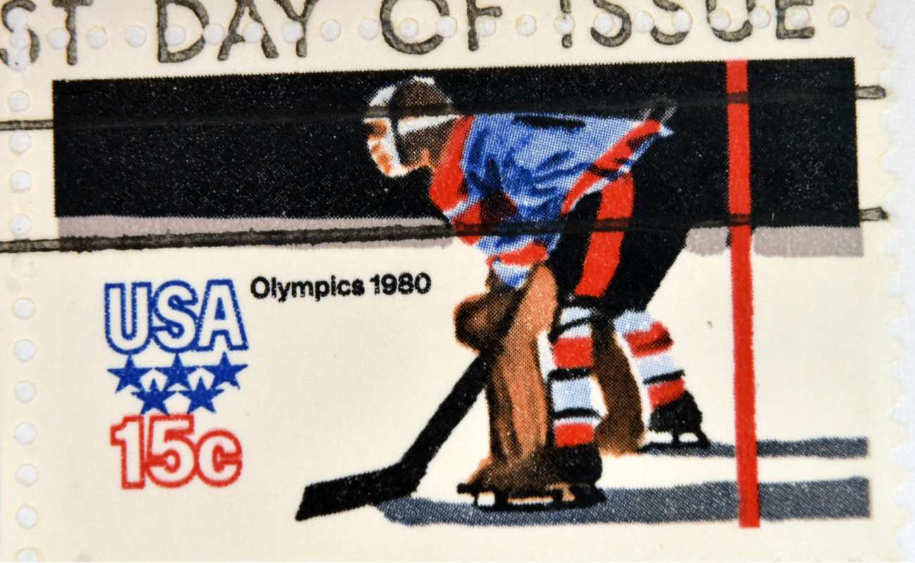 stamp printed in the USA dedicated to the 13th Winter Olympic Games in1980 featuring an ice hockey player