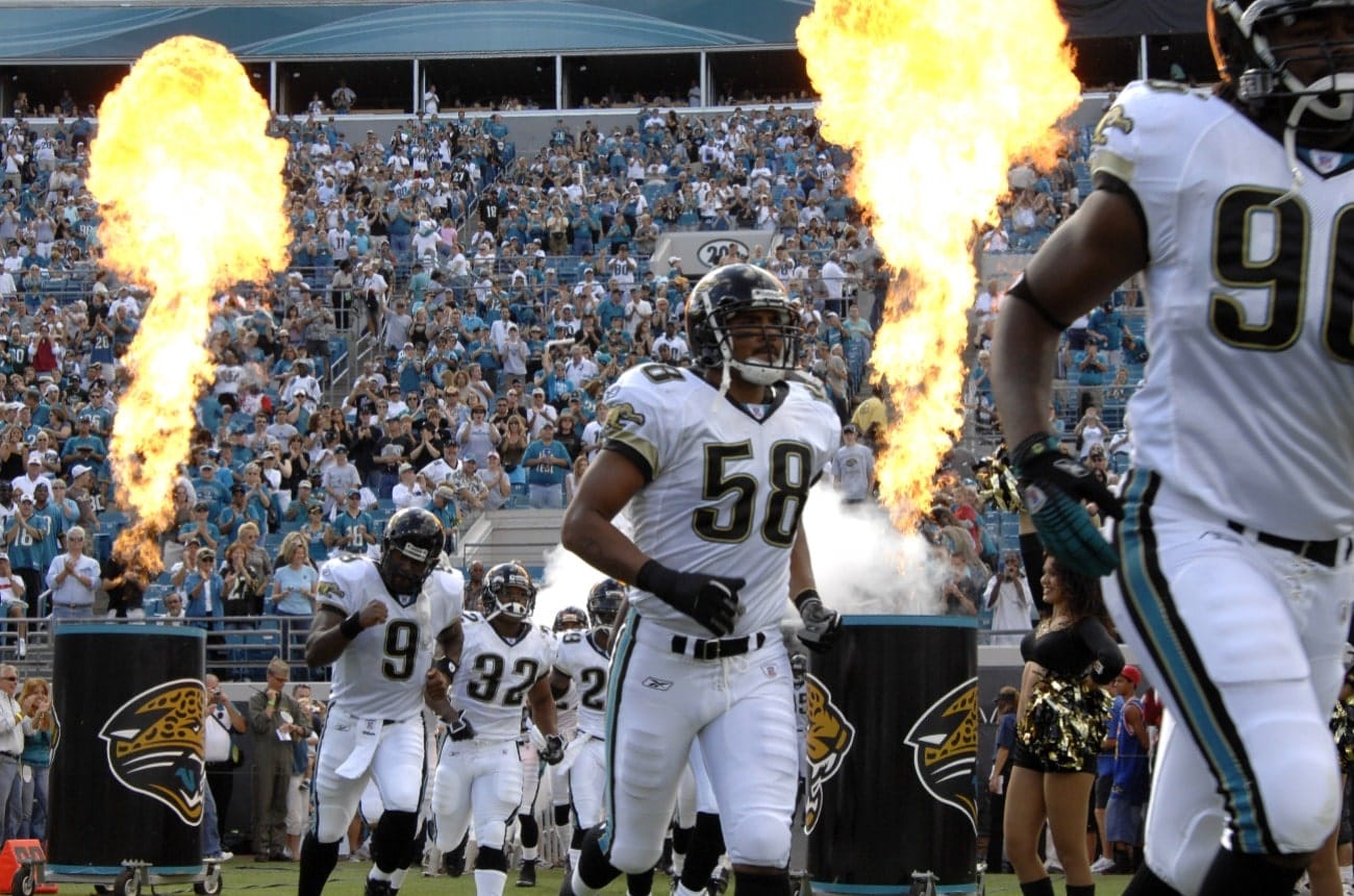 Jacksonville Jaguars dash to the field amid fire and smoke before play against the New York Jets on Ocober 8, 2006 in Jacksonville, Florida.