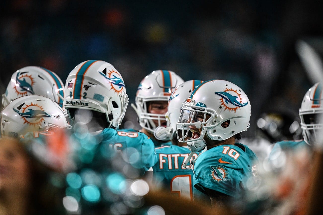 Kenny Stills #10 of the Miami Dolphins reacts in the huddle during the preseason game against the Jacksonville Jaguars at Hard Rock Stadium on August 22, 2019 in Miami, Florida
