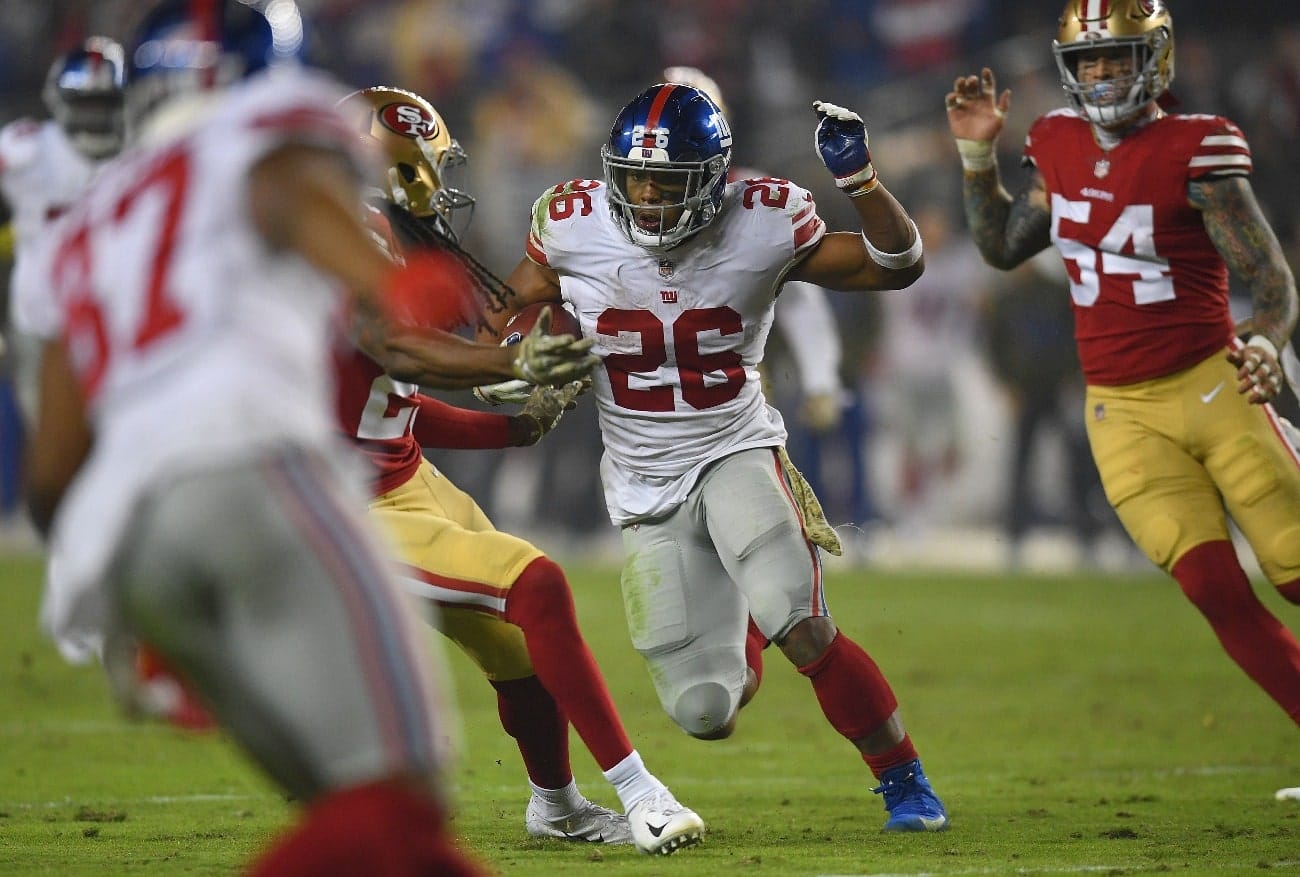 Saquon Barkley #26 of the New York Giants carries the ball against the San Francisco 49ers during the second half of their NFL football game at Levi's Stadium on November 12, 2018 in Santa Clara, California.