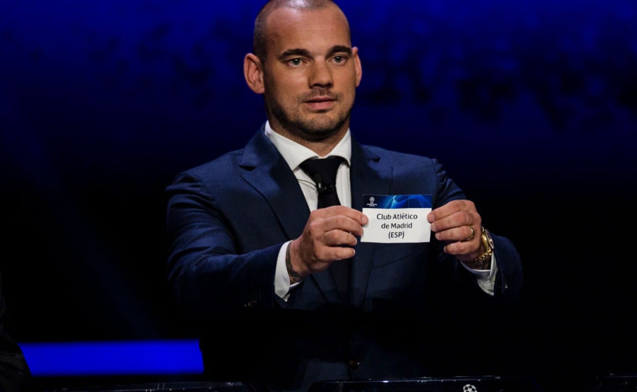 Dutch Soccer Legend Wesley Sneijder Holds Up a Card with Club Atlético Madrid On It - Photo by Eurasia Sport Images / Getty Images